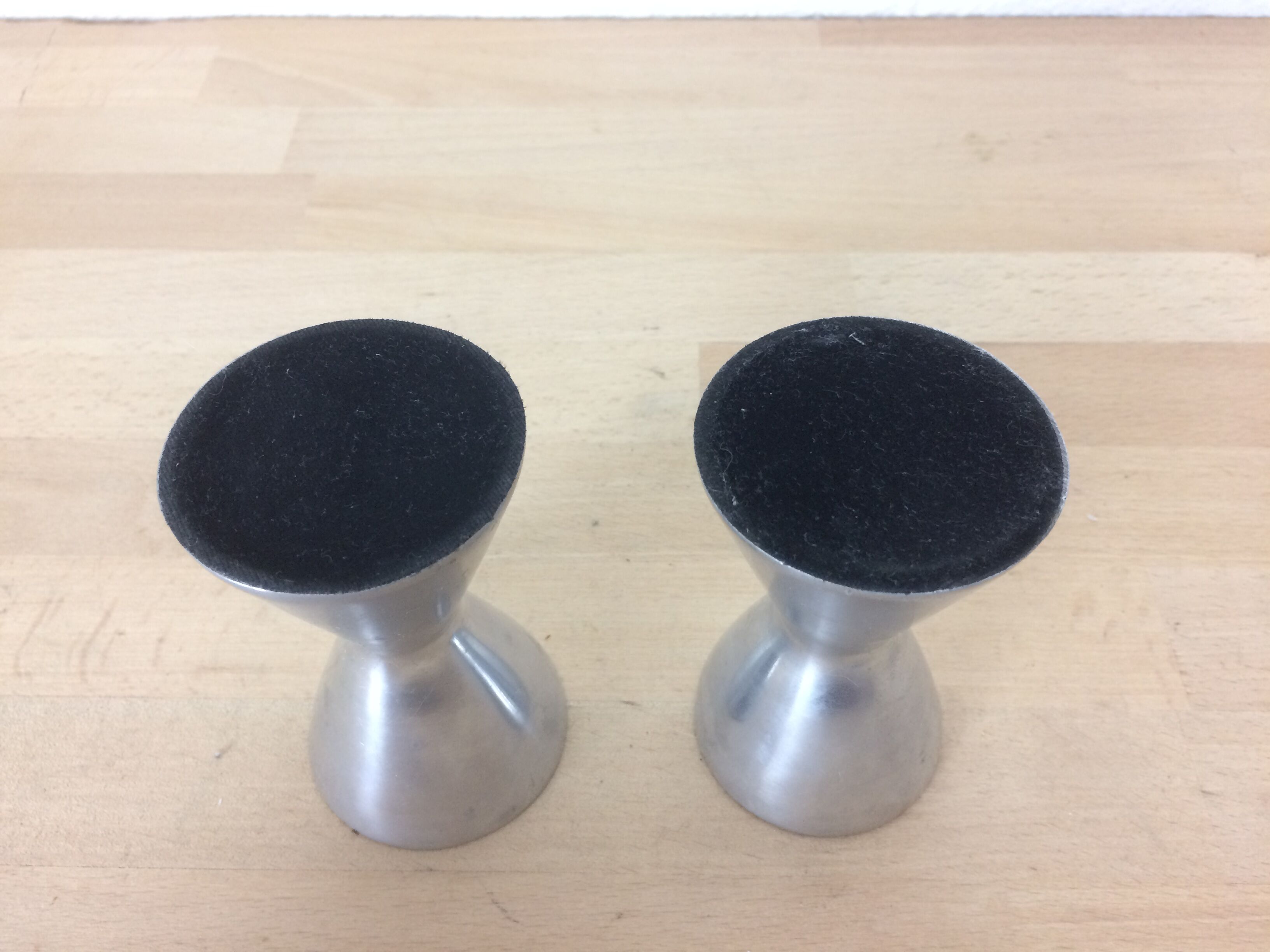 Pair of aluminum diabolo candlesticks