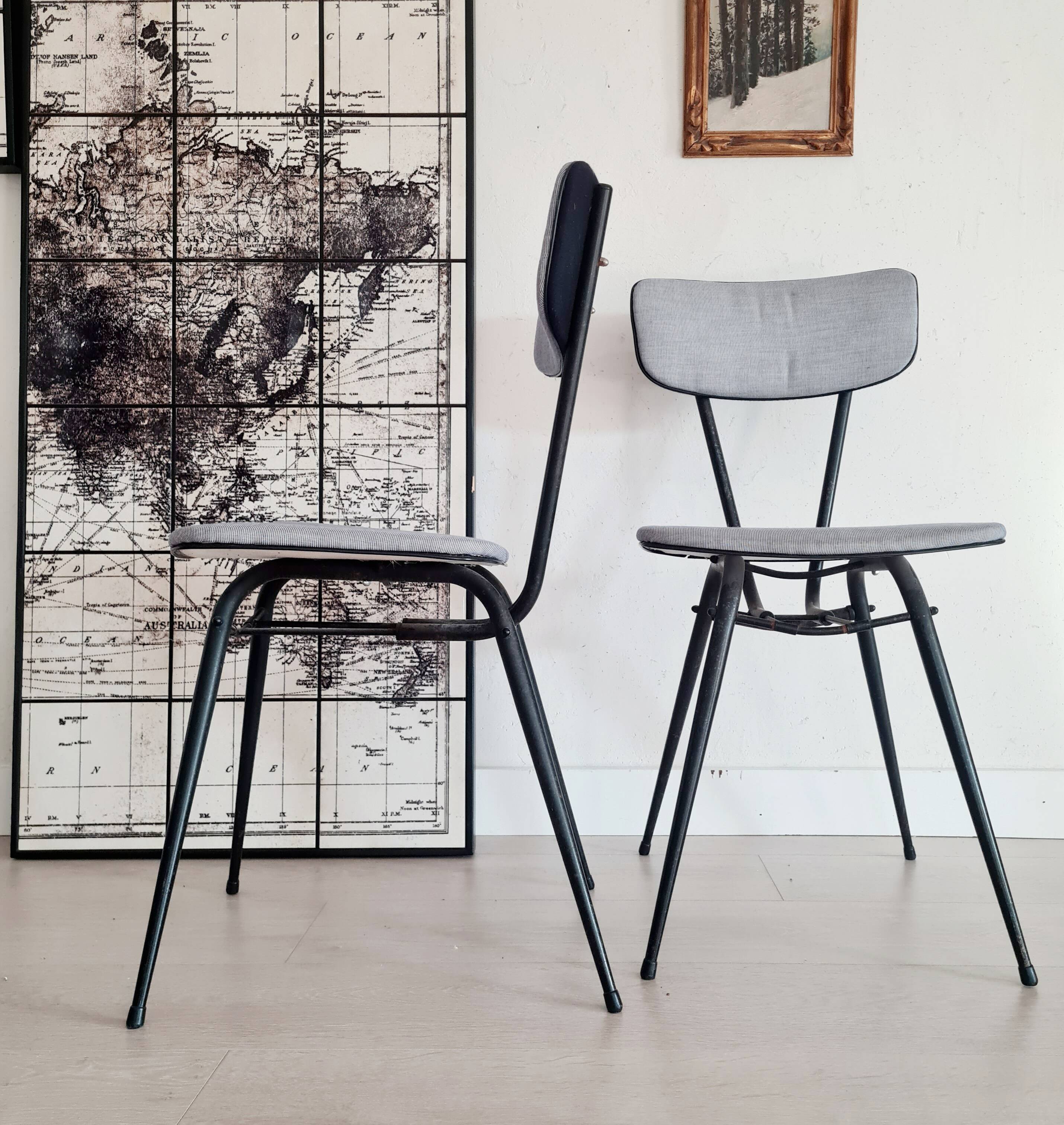 Pair of black metal and blue fabric chairs