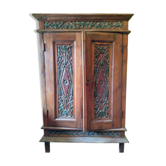 Indonesian cabinet in carved and painted exotic wood