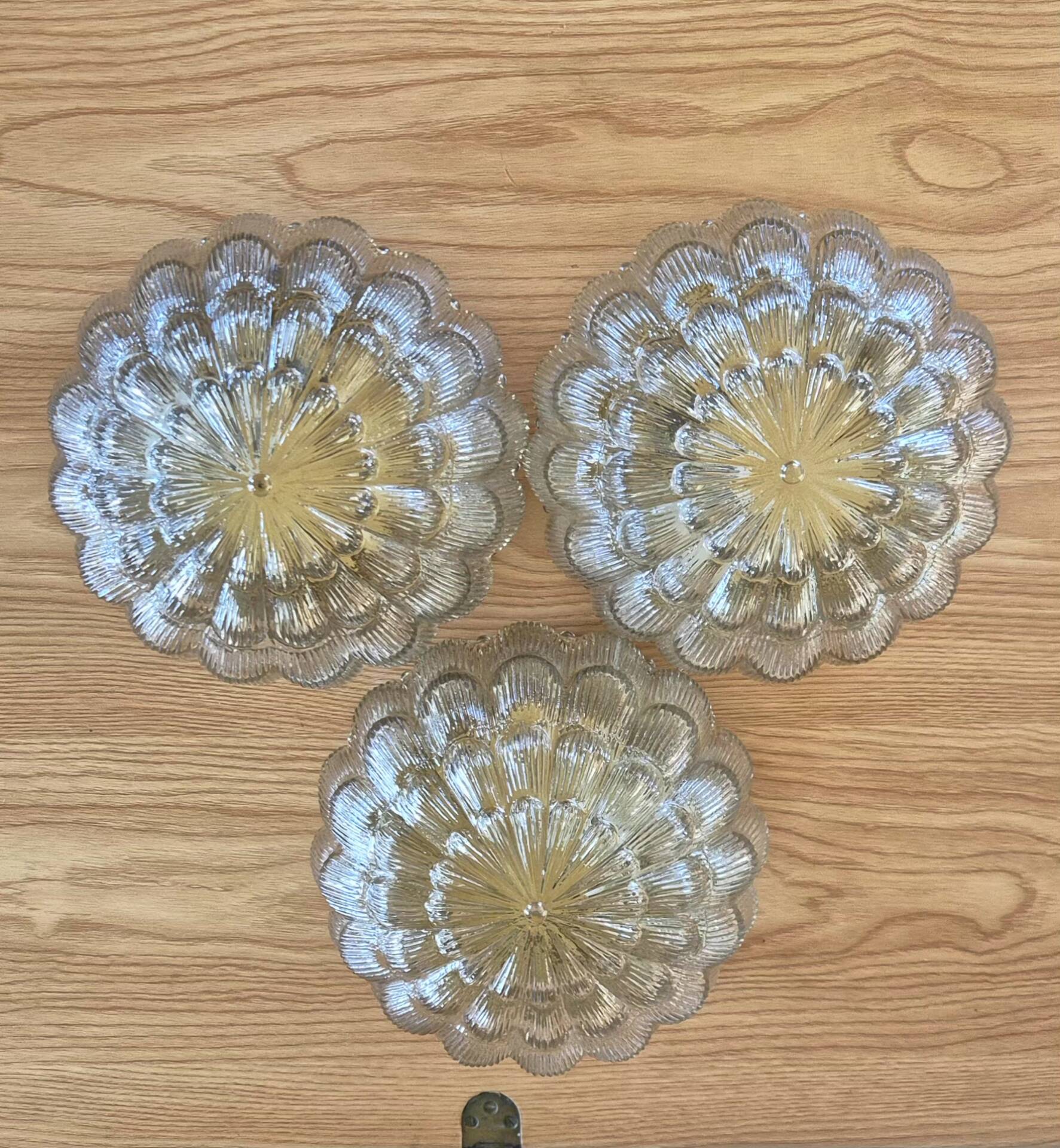 Set of 3 vintage amber moulded glass wall lights and ceiling lights.