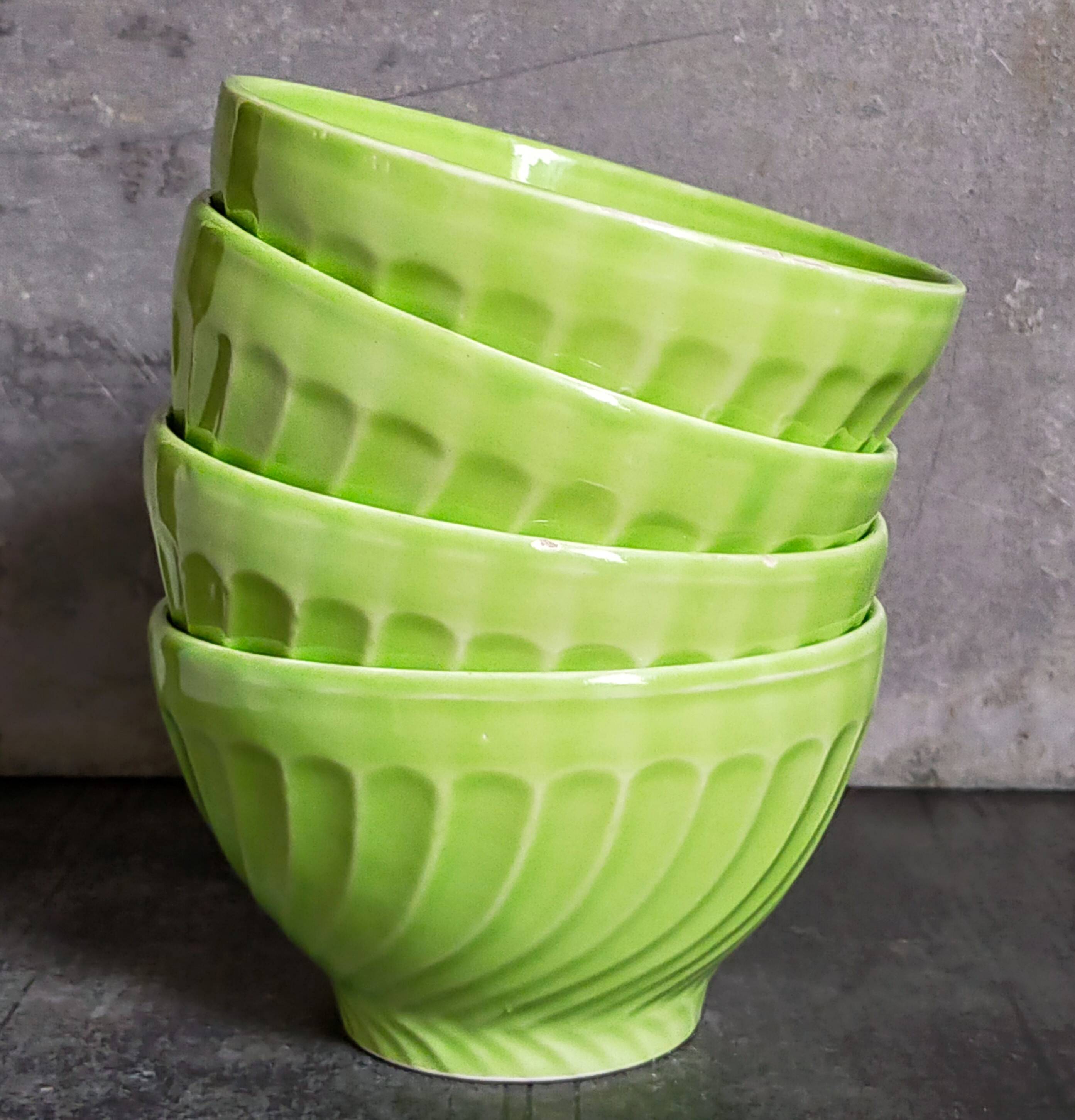 Four vintage spring green earthenware bowls