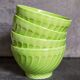 Four vintage spring green earthenware bowls
