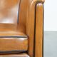 Sheep leather club chair finished with black piping