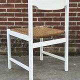 Vintage chair with wicker seat, minimalist design