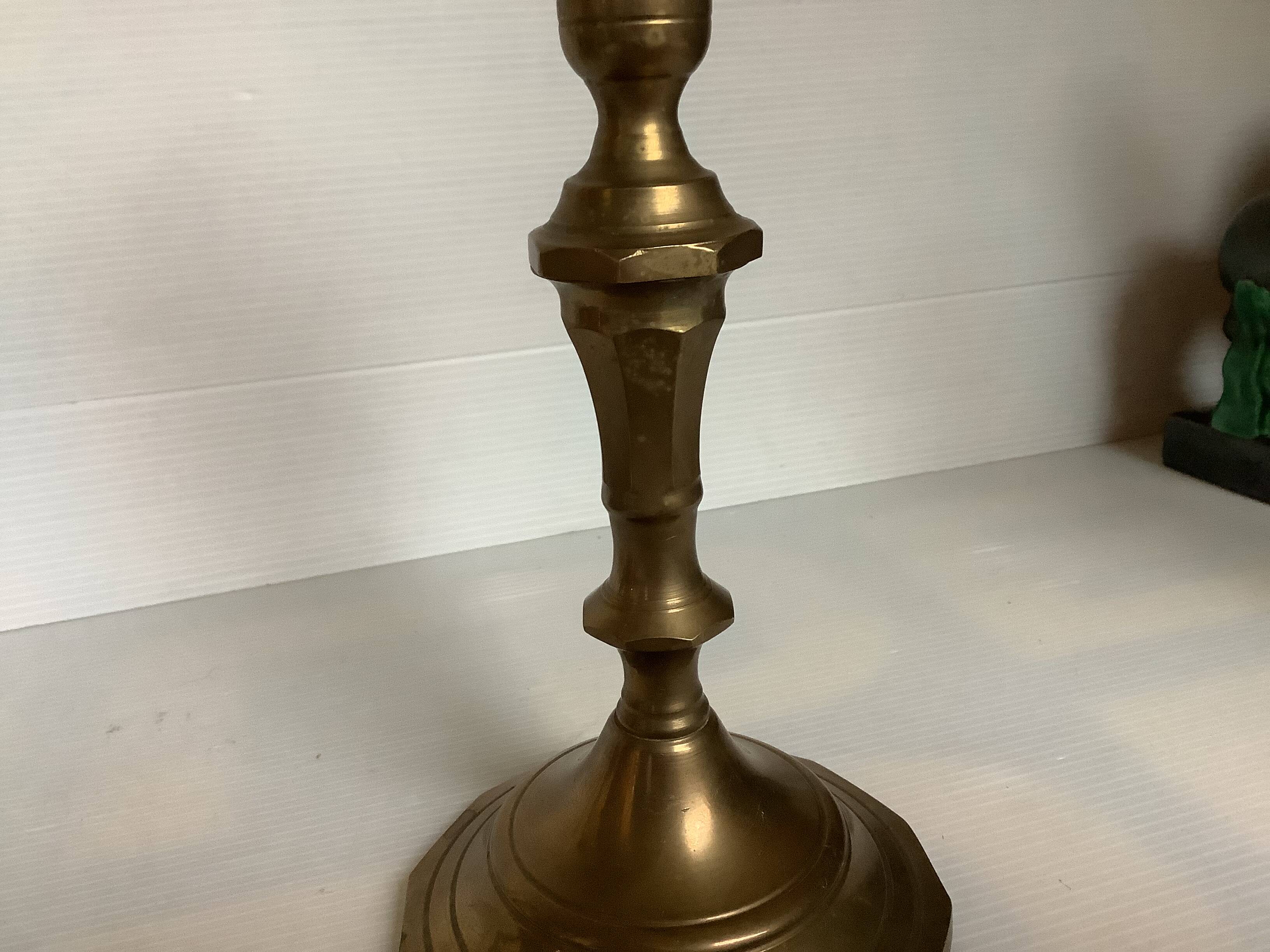 Four brass candle holders