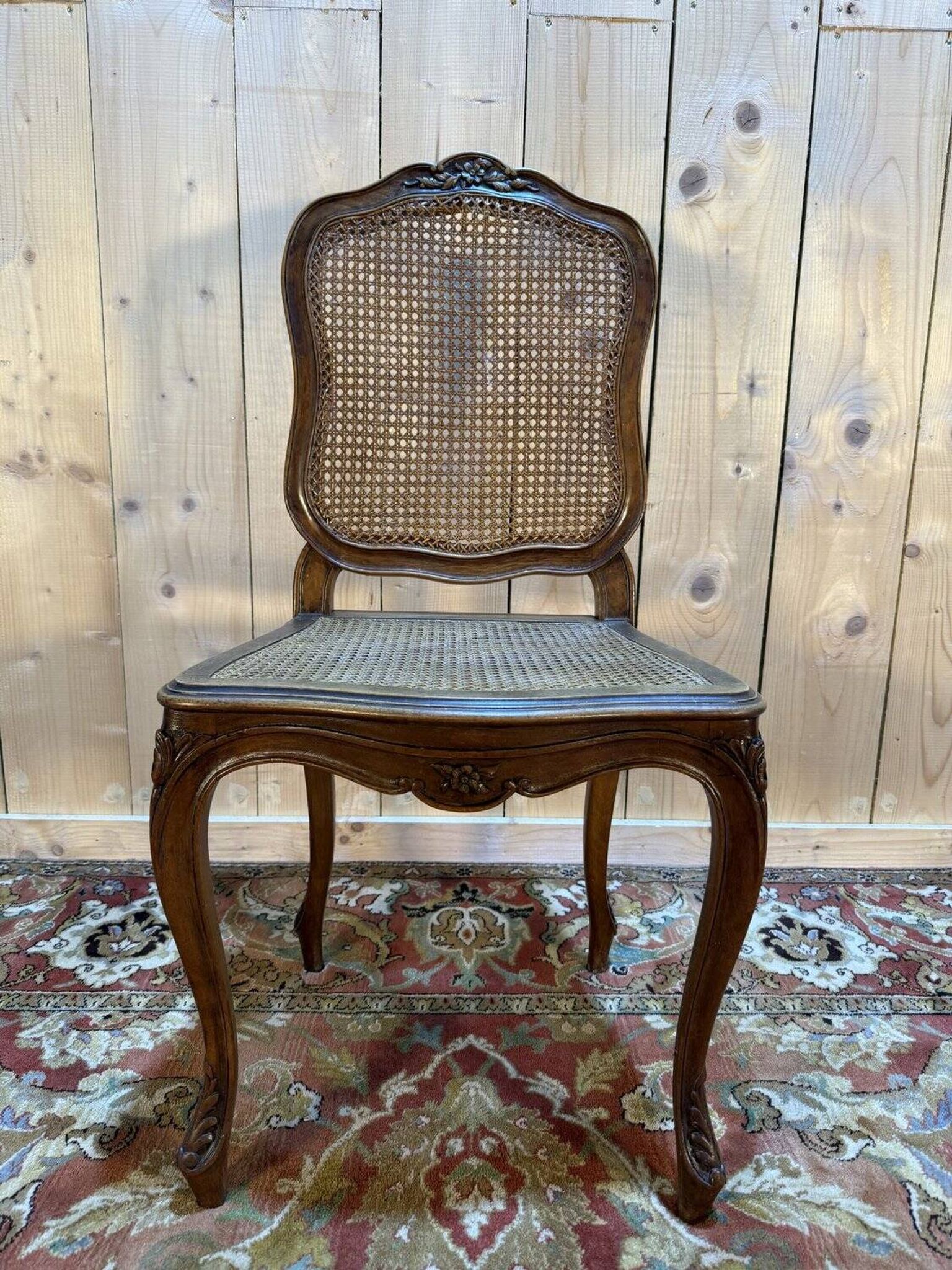 Set of 10 Louis XV style chairs in walnut and cane.