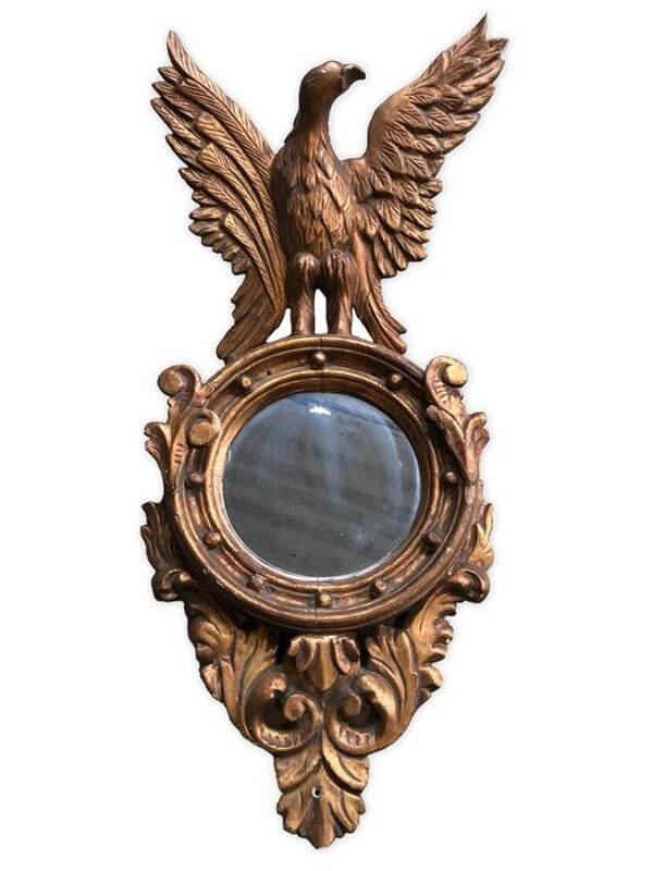 Miroir en bois doré Empire à décor d’aigle 40x97cm