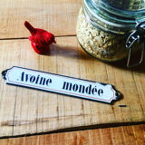 Ancient enamelplate of seed or grocery store. Furniture by trade. 1900s/1910s.