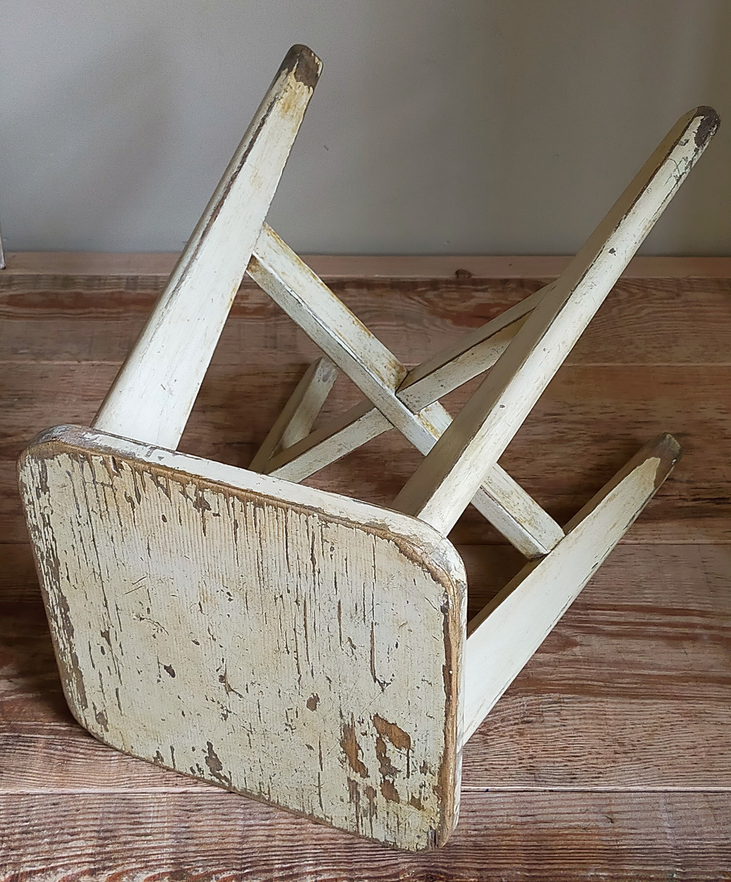 Old workshop stool in patinated solid wood