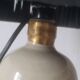 Lamp bottle in gres lampshade in black raffia