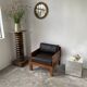 Modernist armchair in exotic wood and leather