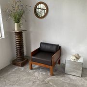 Fauteuil moderniste bois exotique et cuir