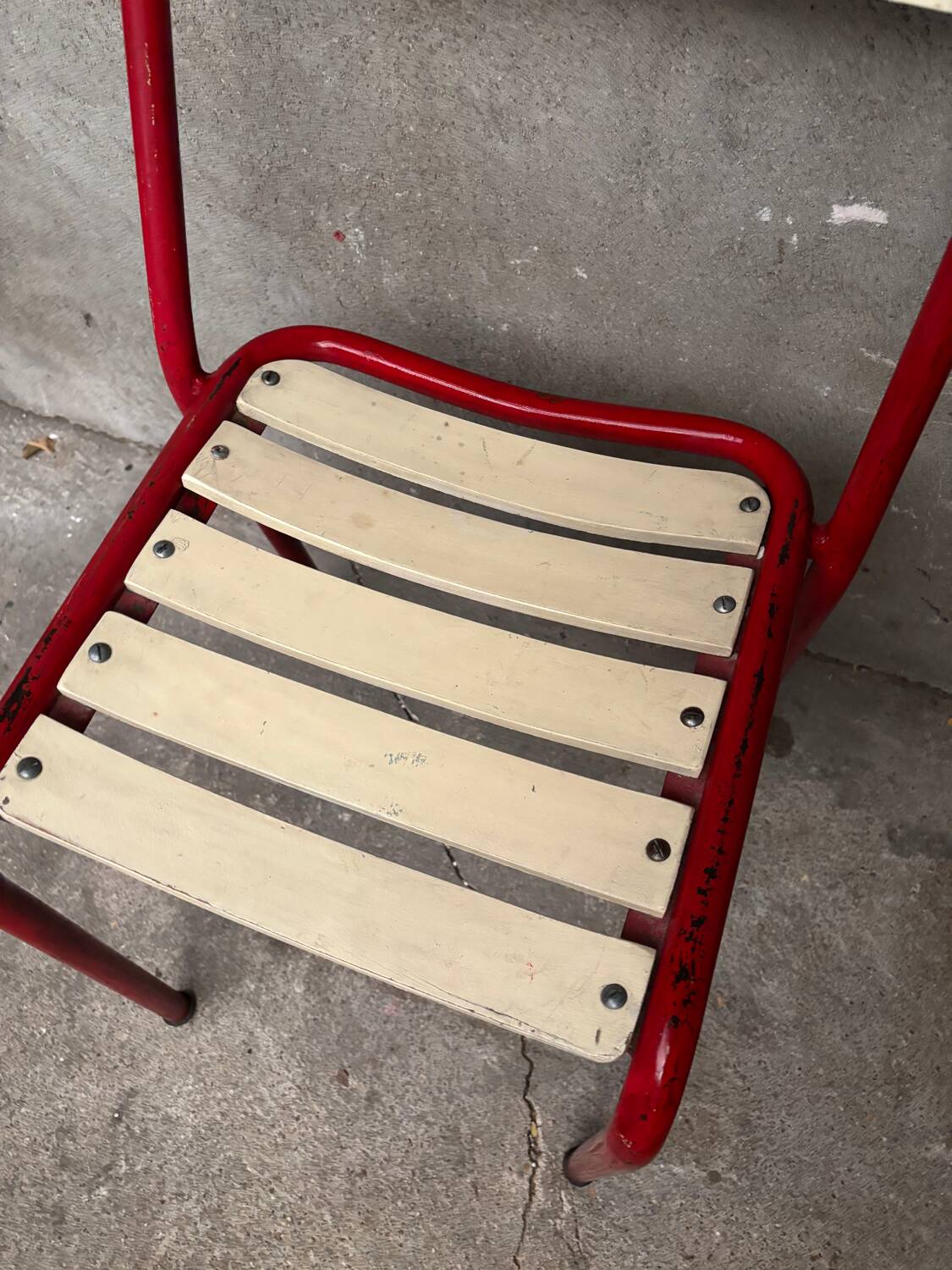 Red and white Tolix chair