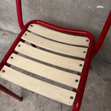 Red and white Tolix chair
