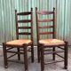Duo of vintage rustic straw straw chairs in oak.