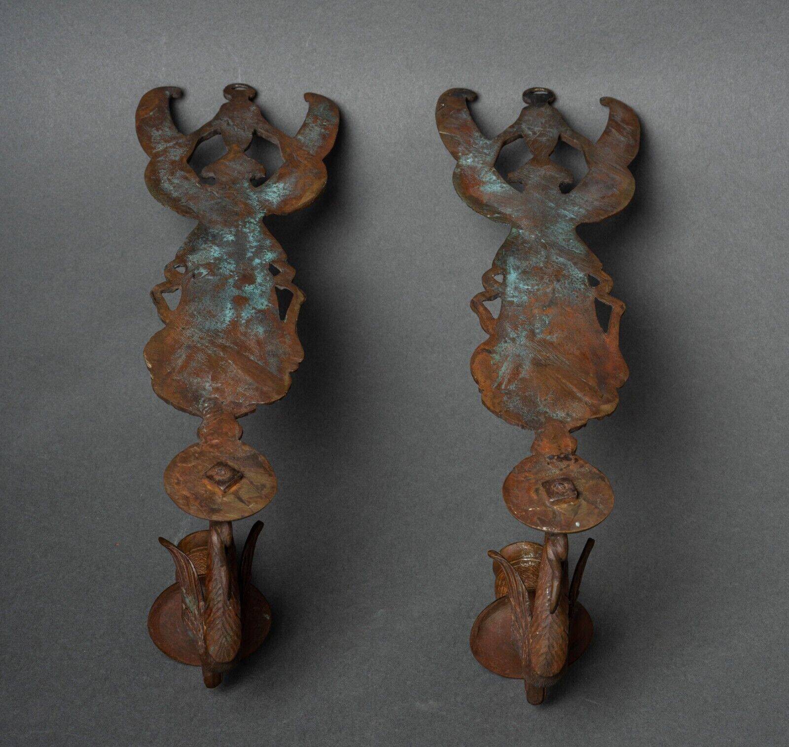 Pair of Empire period bronze sconces decorated with a winged woman
