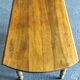 Round table with Louis Philippe shutters, walnut with two extensions.