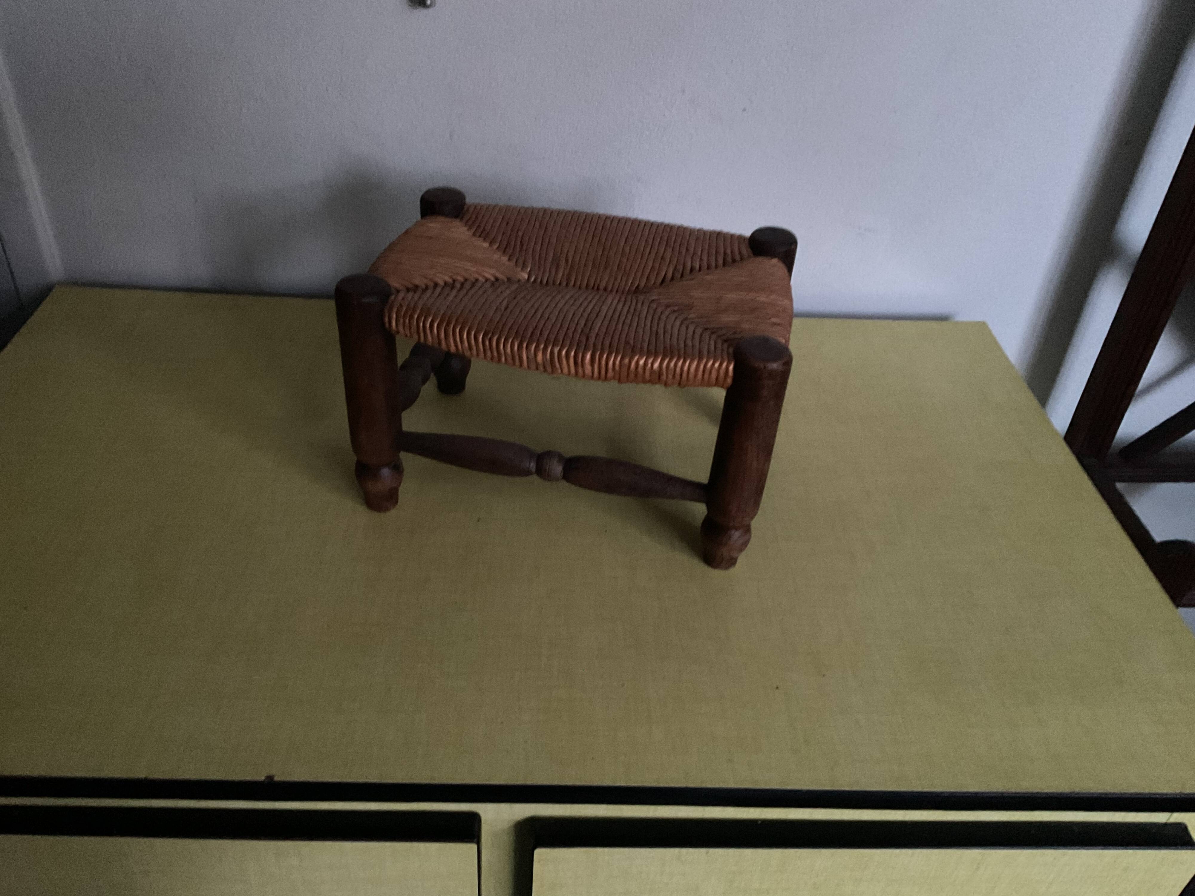 Turned wooden stool and straw