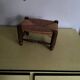 Turned wooden stool and straw