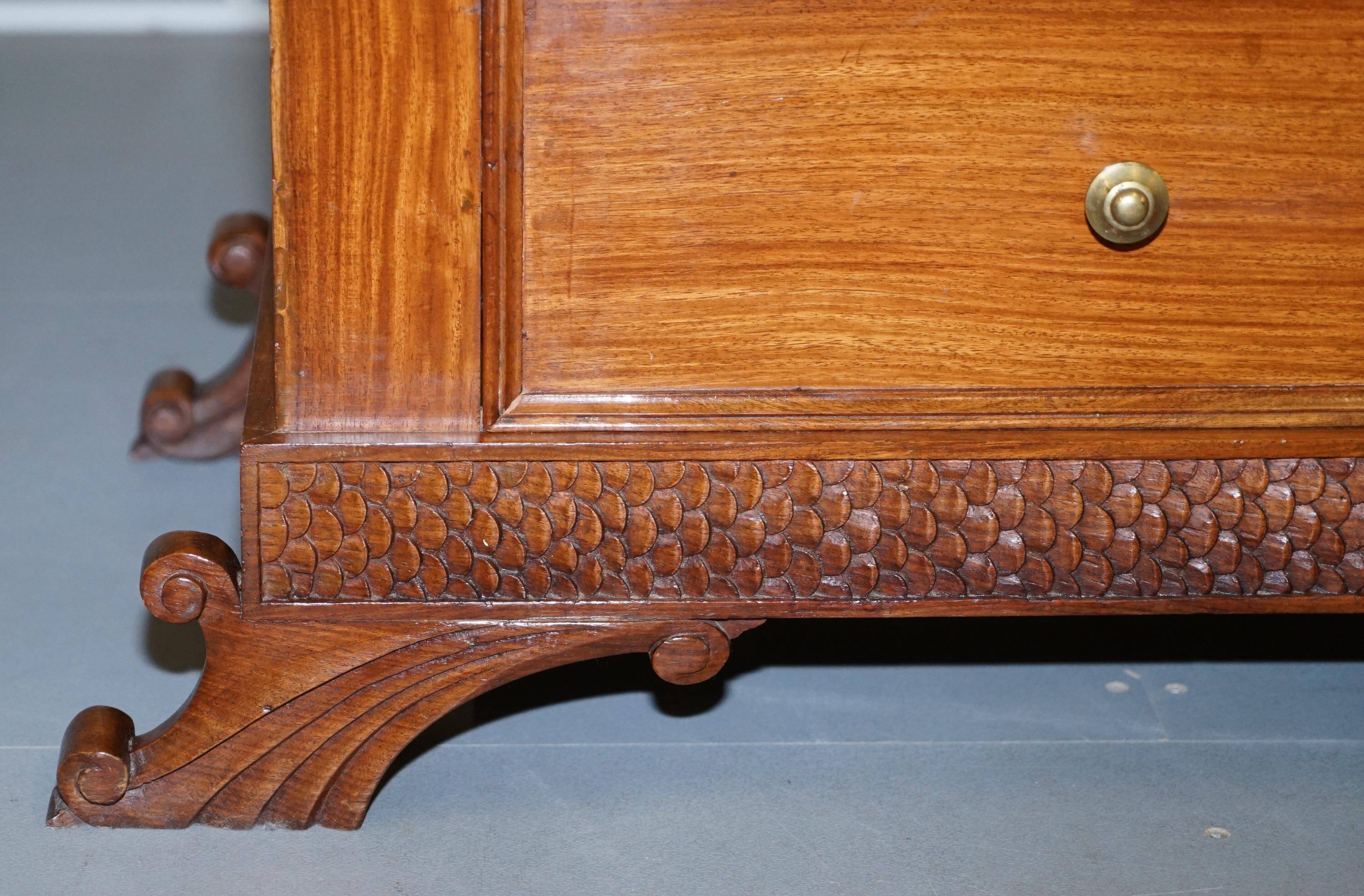 Set of hardwood dressers with finely carved bases.