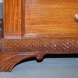 Set of hardwood dressers with finely carved bases.