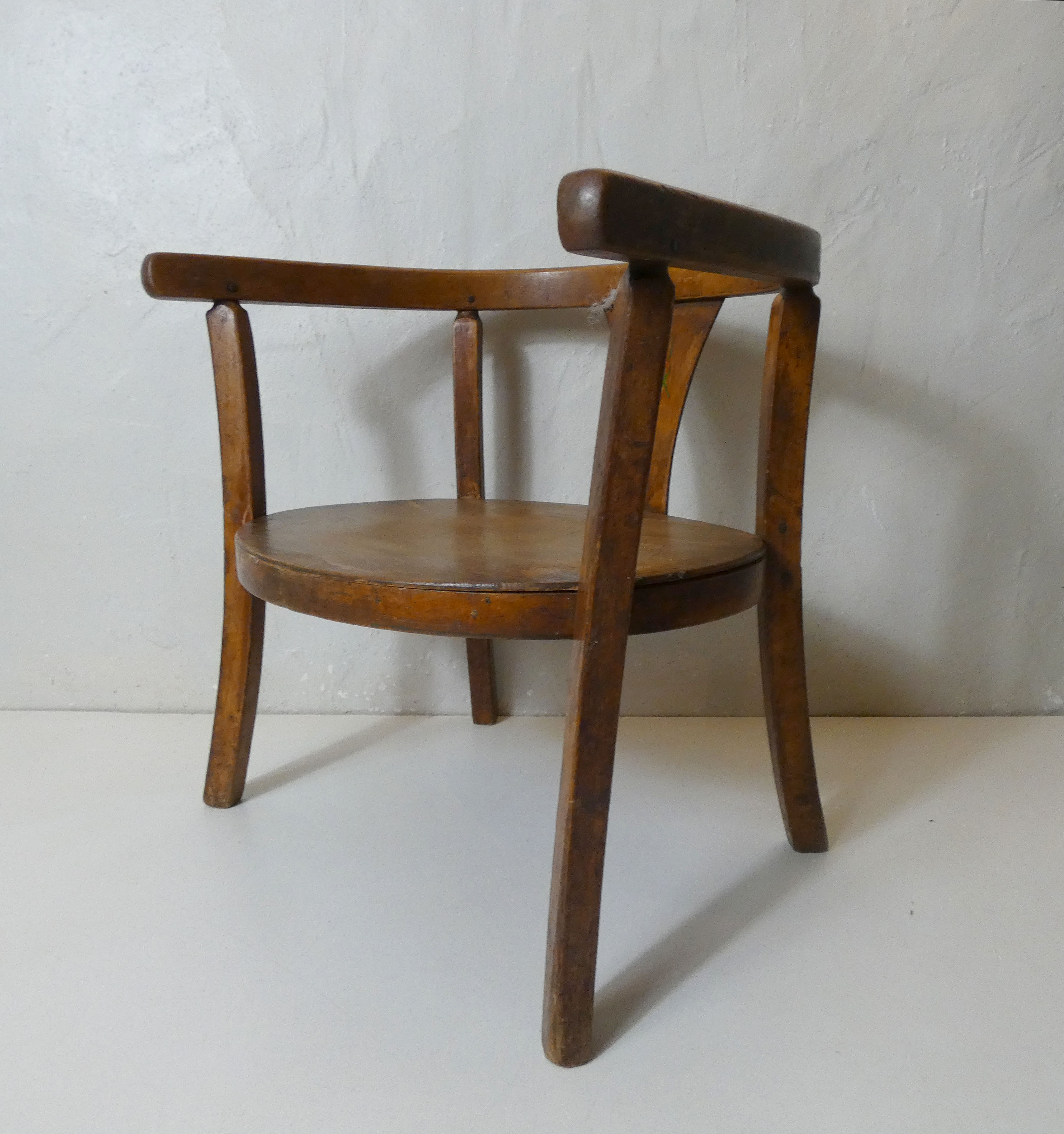 Old wooden armchair for children