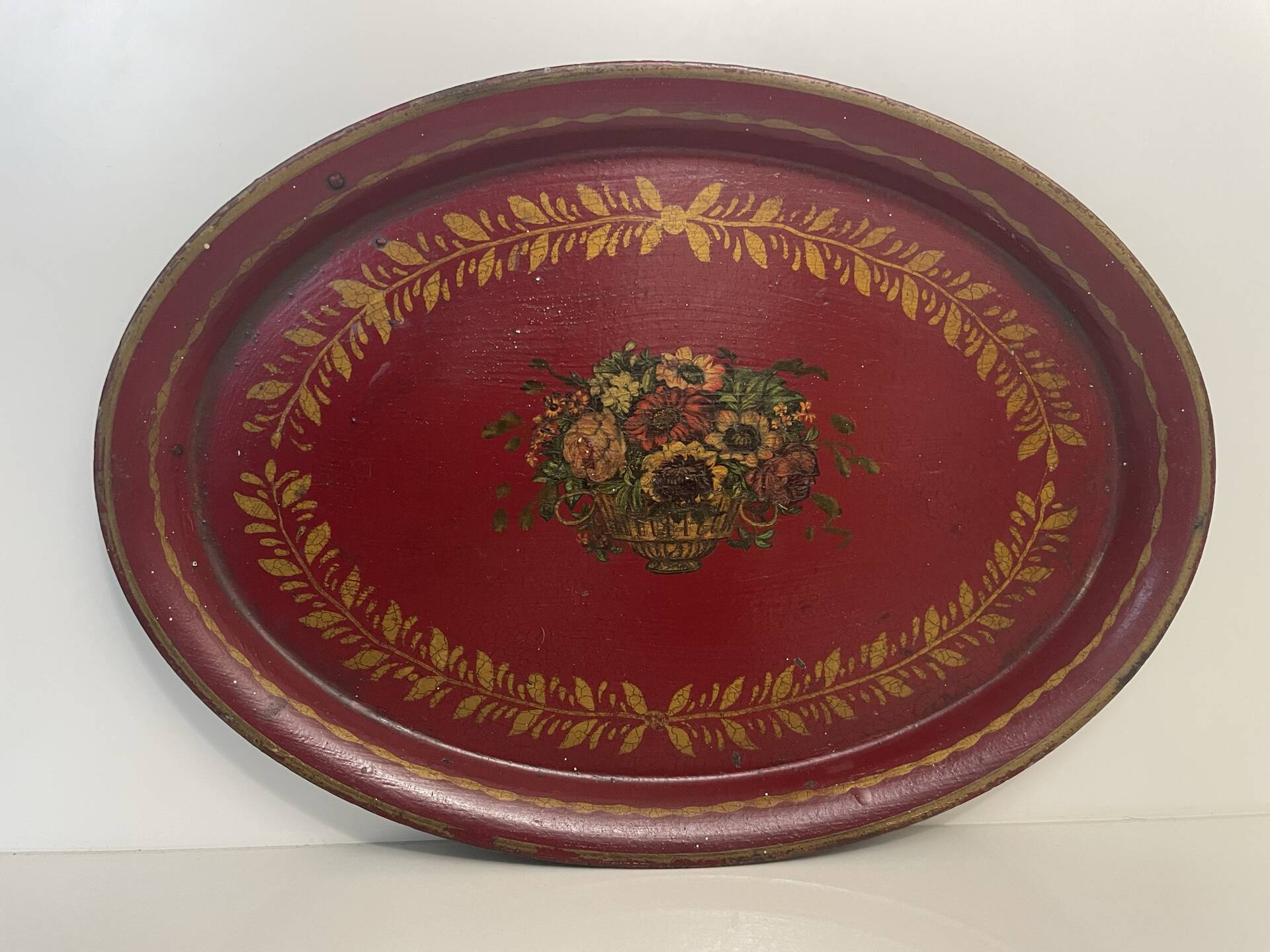 Old oval plate in painted red tin - floral decoration - early 20th century -