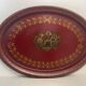 Old oval plate in painted red tin - floral decoration - early 20th century -