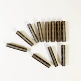 Set of 11 ebony wood knife rests with brass inlay