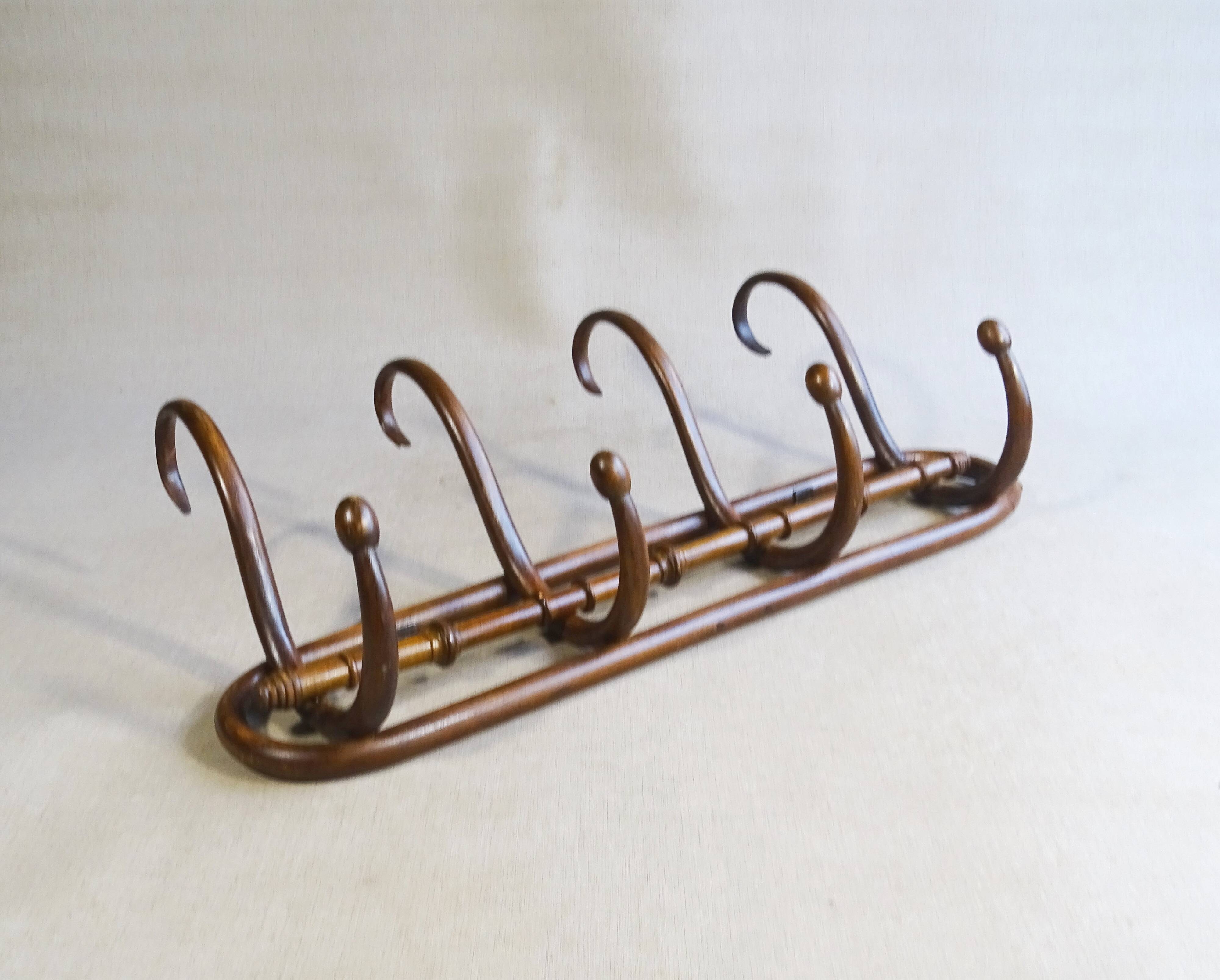 Wall coat rack by Kohn, bent wood 1910, no Thonet.