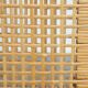 4 wooden Art Deco design dining chairs with a wicker seat and backrest