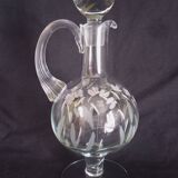 Wine carafe on foot, in cut and enameled glass