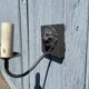 Two lion head wall sconces in tin.