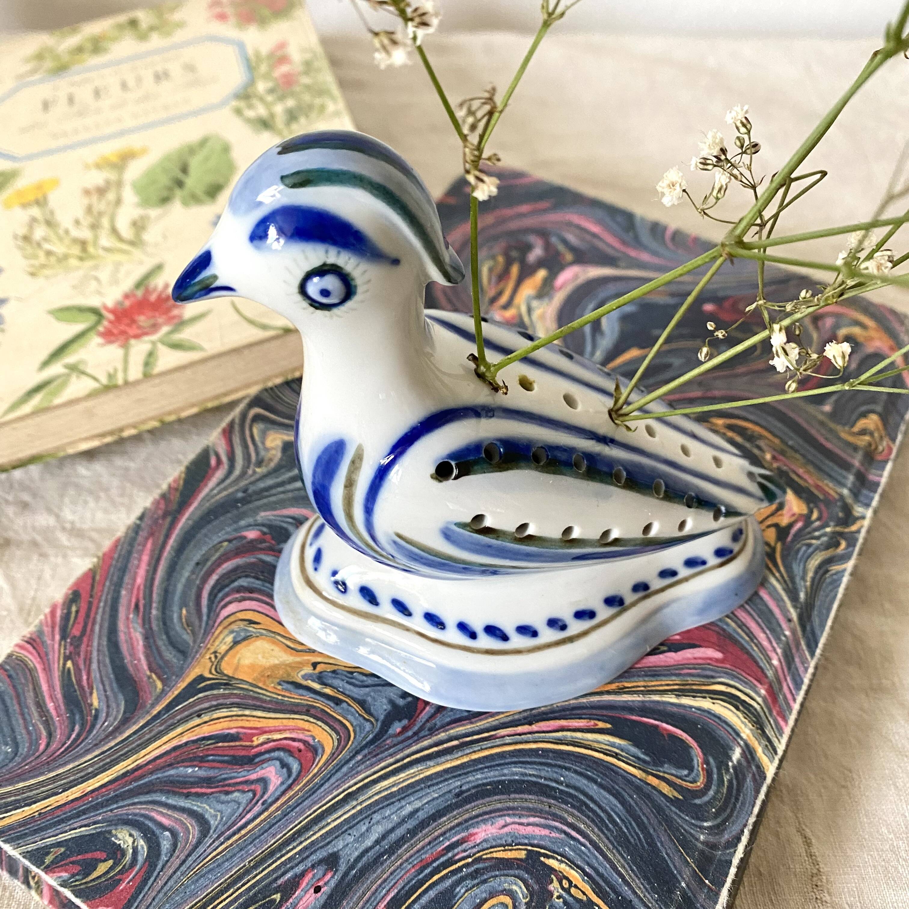 Porcelain bird, flower vase