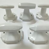 Five art deco white porcelain hooks