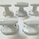 Five art deco white porcelain hooks