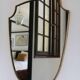 Brass mirror with crest, bead frieze, Italian design style.