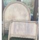 Antique solid wood bed with a carved rounded headboard — Louis XV style