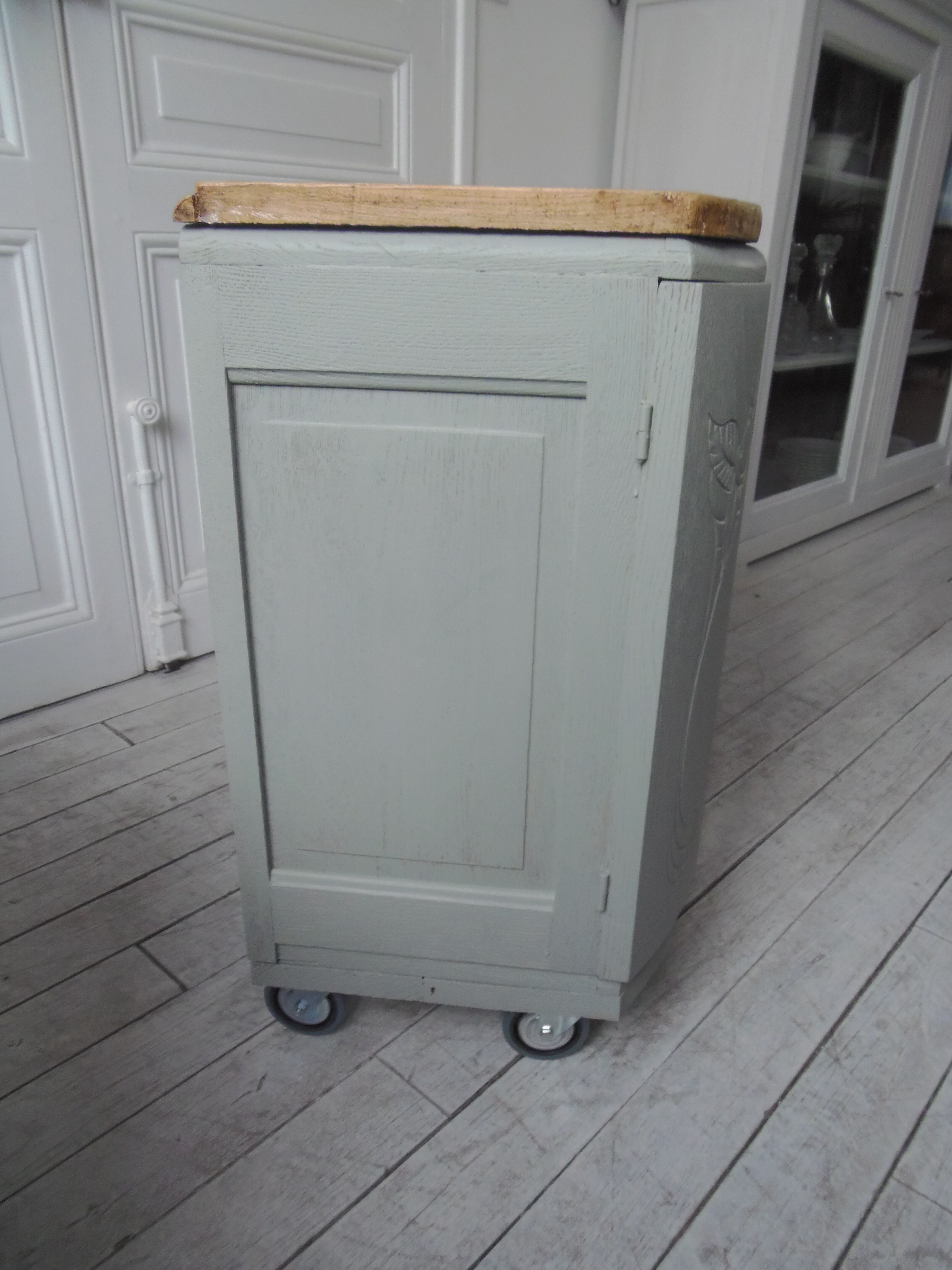 Art Deco furniture revisited in gray green and placed on wheels.