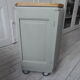 Art Deco furniture revisited in gray green and placed on wheels.
