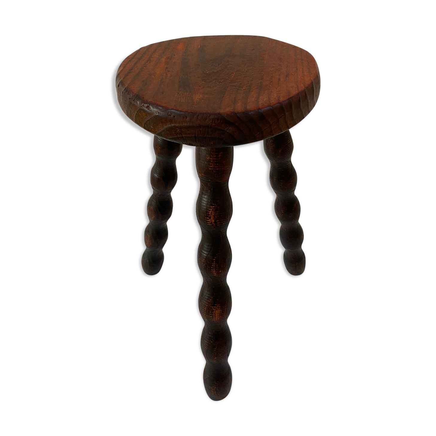 Old tripod stool in solid wood