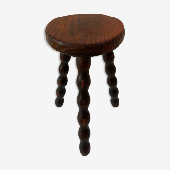 Old tripod stool in solid wood