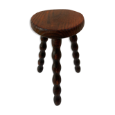 Old tripod stool in solid wood