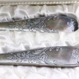 Old covered box in silver or silver metal spoon and fork with hallmarks