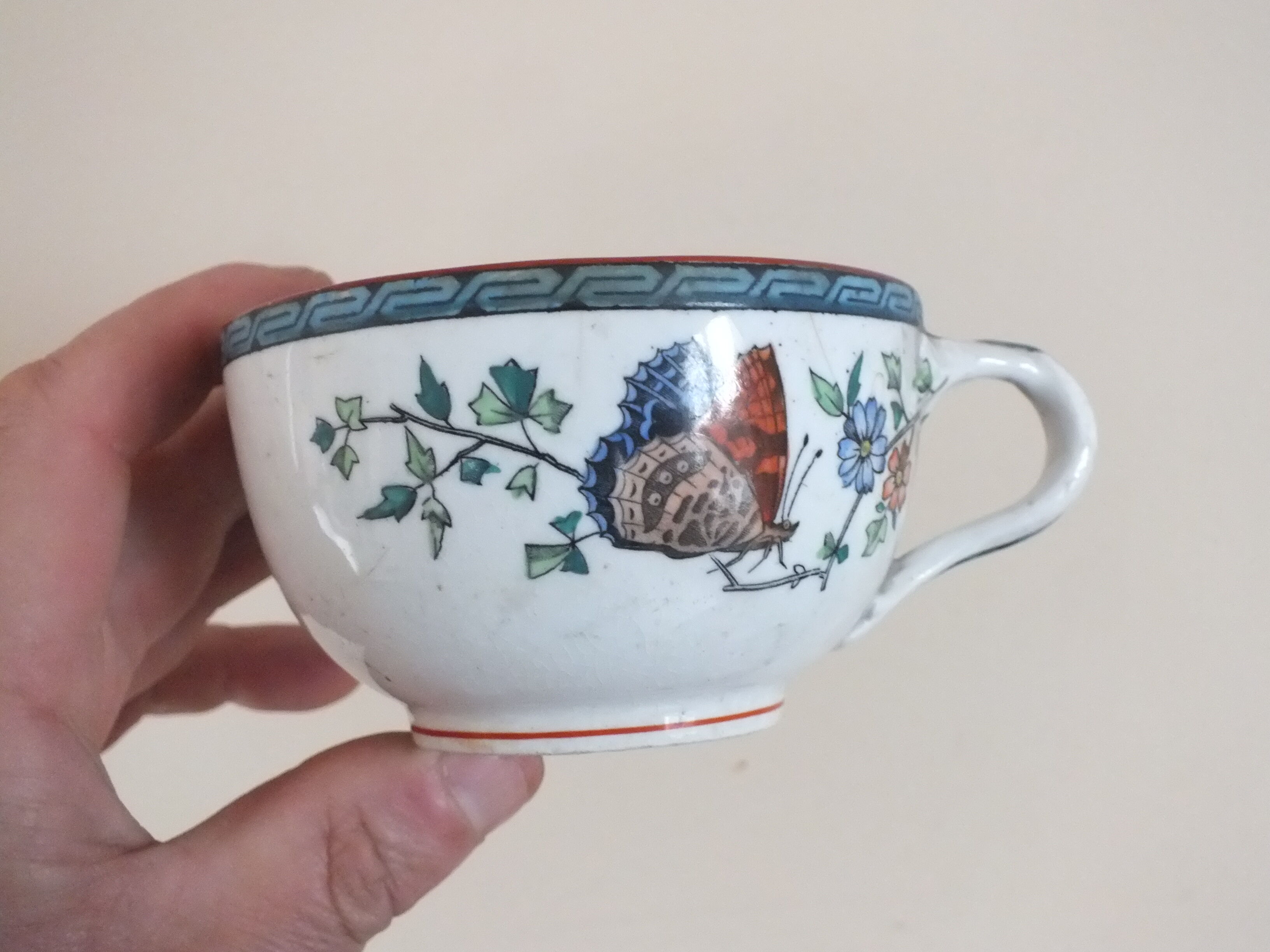 3 cups of English porcelain decorated with butterflies