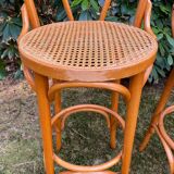 Set of four cane and webbing bar stools