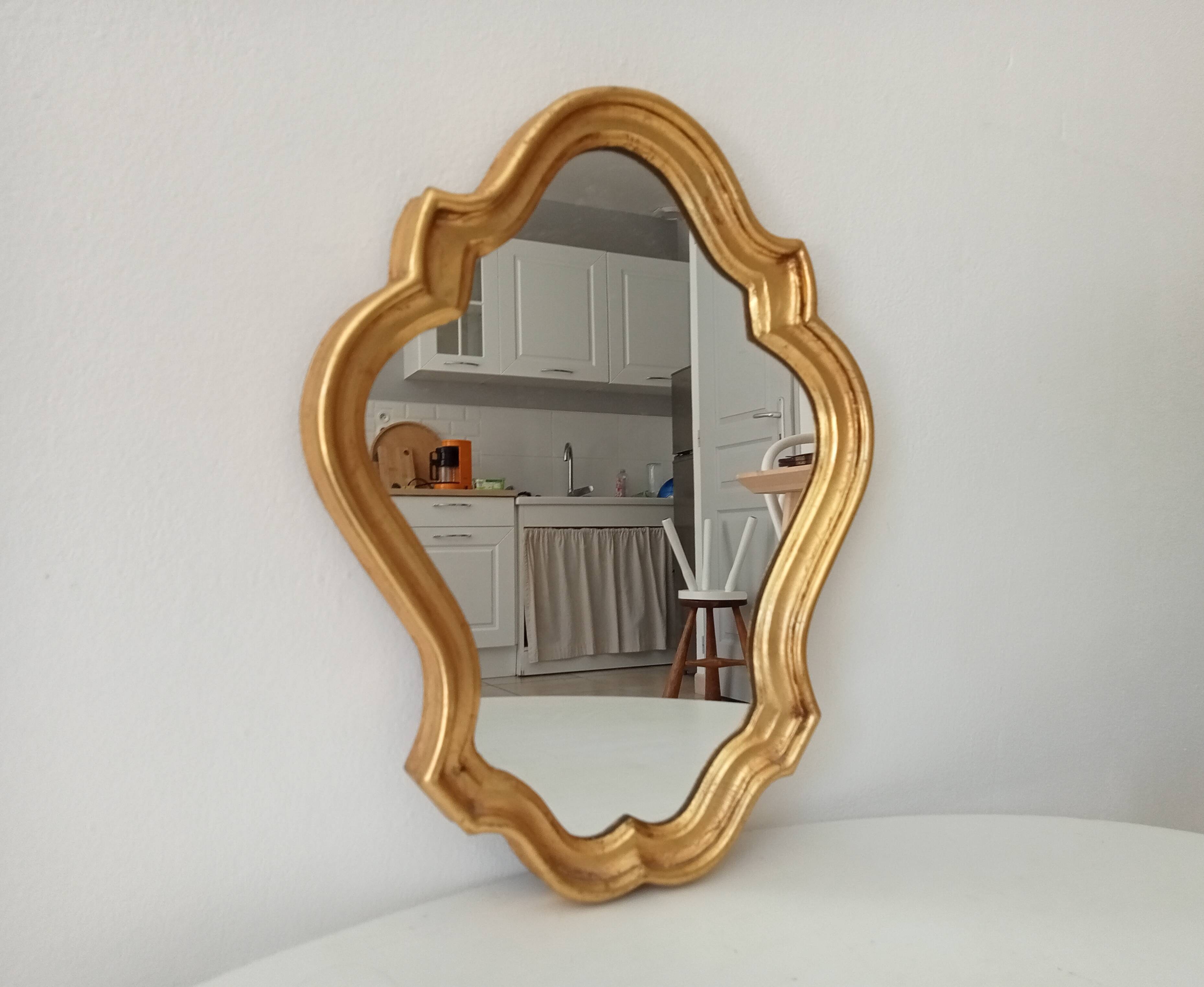 Baroque mirror in gilded wood from the 1960s.
