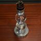 1950s lamp made up of two glass balls and a stainless steel base