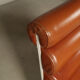 Pair of sculptural cognac leather armchairs, 1970s