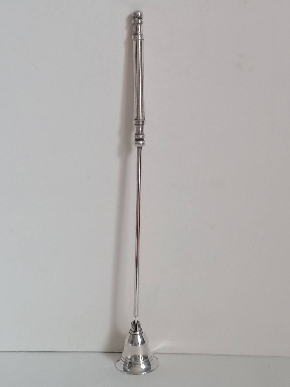Silver metal candle snuffer